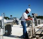 A treatment plant operator monitors the fermenter at the Douglas L. Smith Middle Basin Treatment Plant