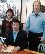 Blumenfeld signs a stipulated order to protect San Francisco Bay. Also pictured are Michelle Moustakas, EPA engineer, and Hugh Barroll, EPA attorney.