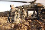 U.S. Army soldiers run after getting of a Blackhawk helicopter during an air assault mission in Ludifiyah, Iraq, in 2008. U.S. Army photo by Spc. Richard Del Vecchio