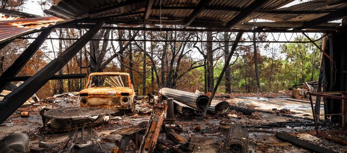 Charred Car at Wildfire Scene Aftermath